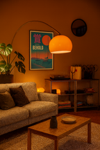 Poster featuring silhouetted sailboats under a vibrant orange sunset